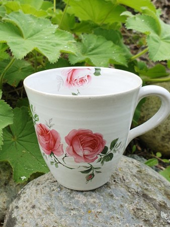 Kopp med rosa blomster